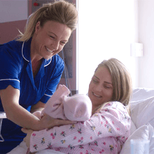 Midwife with baby